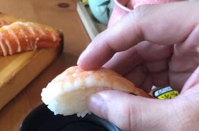 Do you eat sushi with hands or chopsticks?
